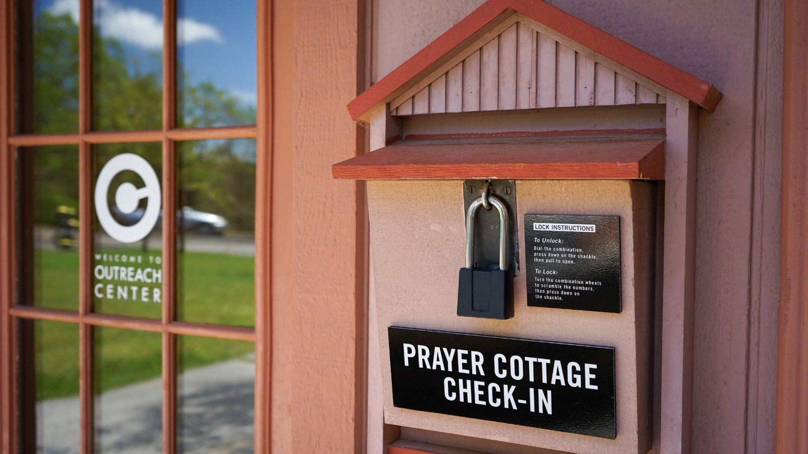 The Prayer Cottage check-in box beside the side door of the church