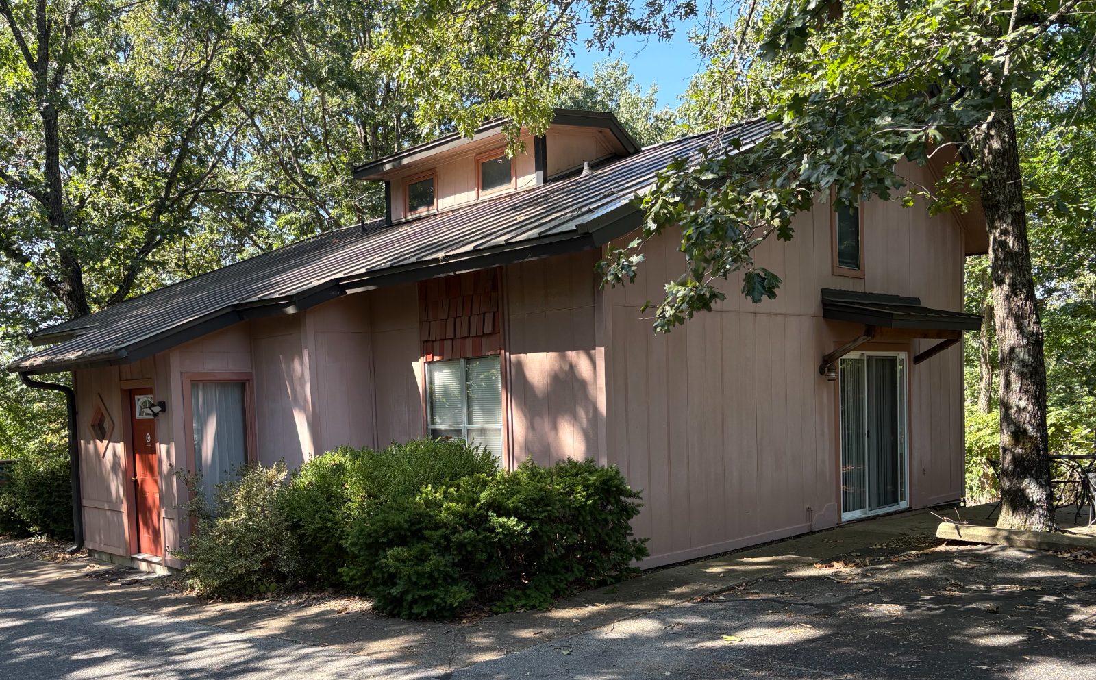 Hill Haven, the duplex Outreach Center Church provides for missionary housing, set among oak trees