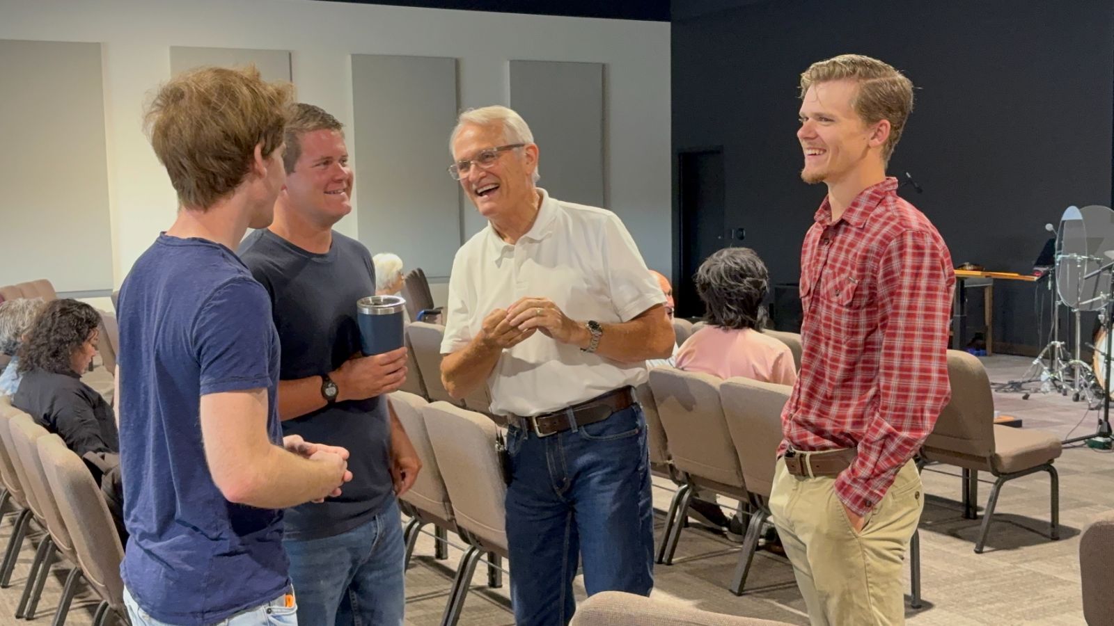 Members of Outreach Center Church talking together after a service